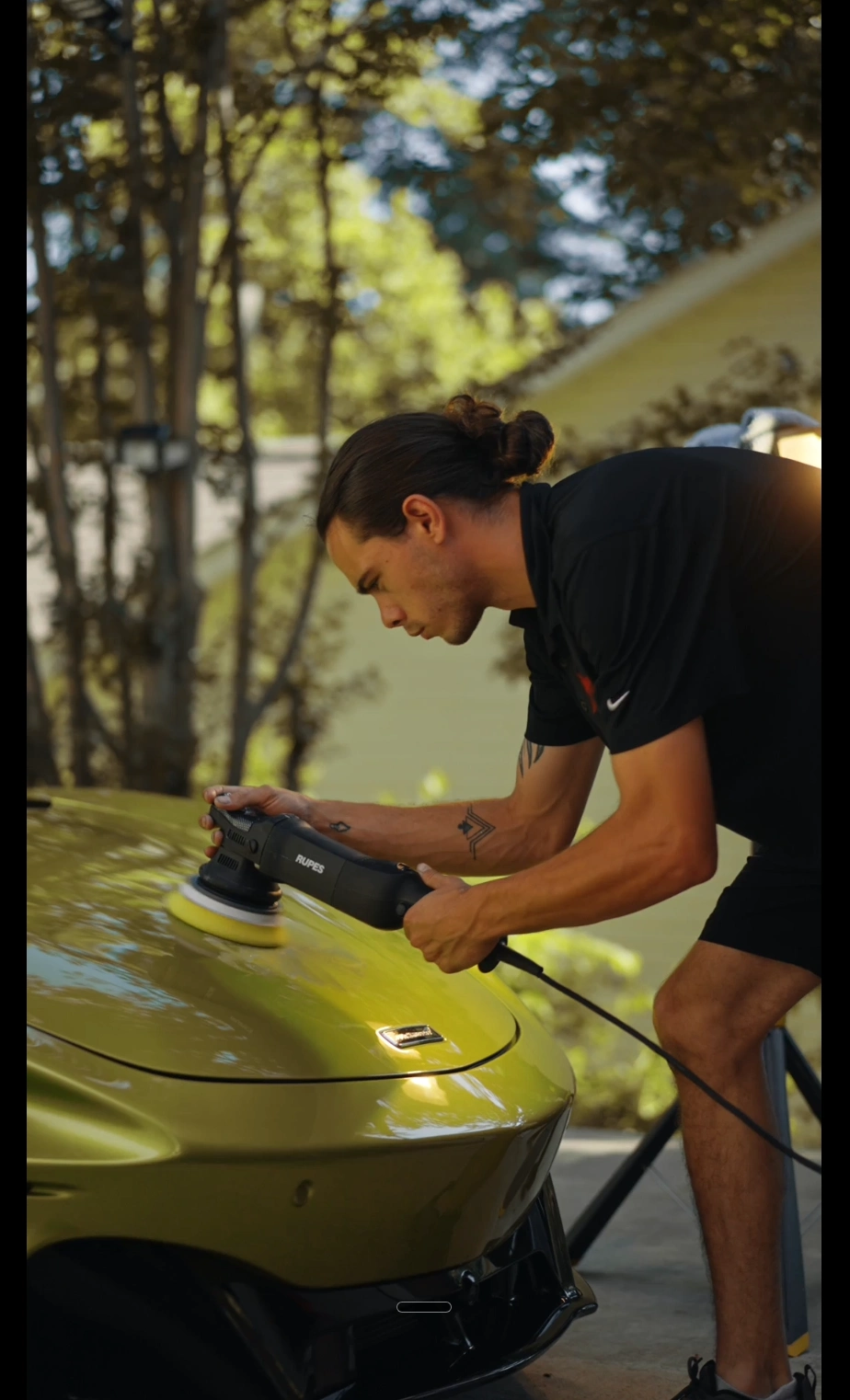 Michael performing paint correction with a RUPES machine polisher